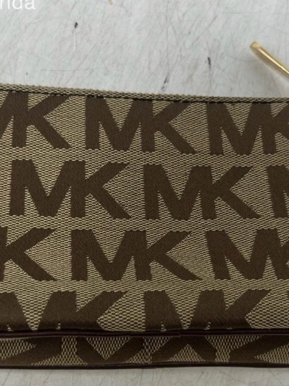 Michael Kors Brown and Tan Signature MK Wristlet with Gold Plate